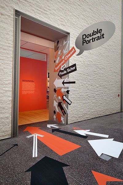 Arrows guide visitors to the exhibition in the Collab Gallery in the PMAs Perelman Building.: Double Portrait, Paula Scher, Floor Graphics, Wayfinding Design, Environmental Graphic Design, Exhibition Stand Design, Exhibition Display, Wayfinding Signage, Shopping Centre