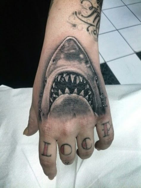 #shark #tattoo #black #grey #jaws Jaws Shark Tattoo, Jaws Tattoo Movie, Jaws Tattoo Ideas, Jaws Movie Tattoo, Megladon Shark Tattoo, Tigershark Tattoo, Shark Hand Tattoo, Shark Head Tattoo, Jaws Tattoo