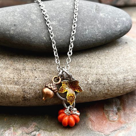 Pumpkin Fall Handmade Necklace - Fall Lover Jewelry This fall lovers necklace is a great addition to your fall wardrobe!  It comes with all charms as shown, and the pumpkin charm has been dipped in a clear coating for extra protection while wearing.   Available in many chain lengths. INSTRUCTIONS for additional questions:  1.  Email photos to touchofwhimsybyjen@yahoo.com 2.  Private msg on Facebook page at https://www.facebook.com/touchofwhimsybyjen/ 3.  Send through message on Etsy messenger ** Halloween Jewelry Diy, Pumpkin Jewelry, Fall Lovers, Pumpkin Necklace, Goth Clothes, Fall Rings, Beads Craft Jewelry, Autumn Necklace, Lover Jewelry