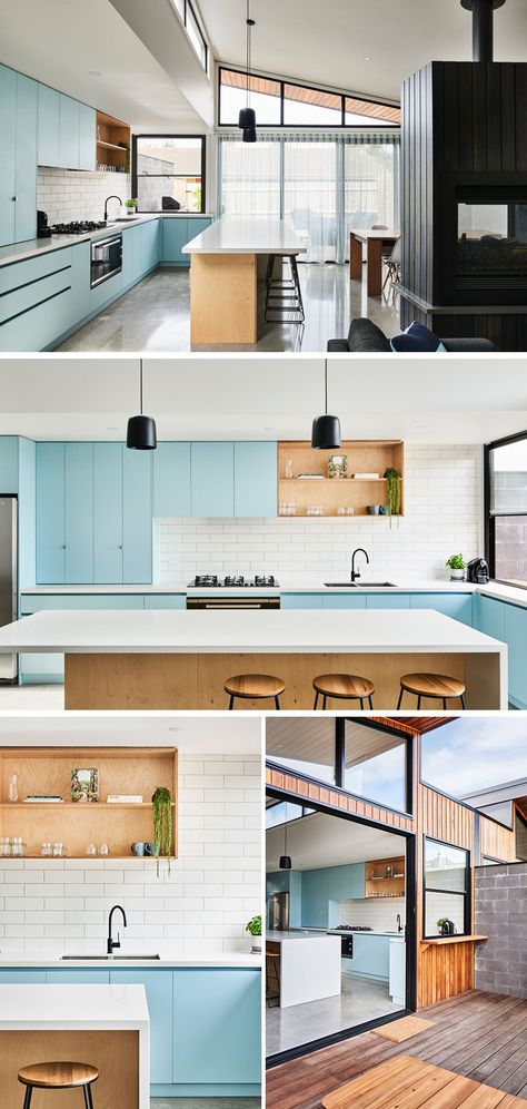 In this modern kitchen, matte light blue cabinets are paired with a white tile backsplash, plywood open shelves and island, and light Caesarstone countertops. #KitchenDesign #ModernKitchen #BlueKitchen Modern Light Blue Kitchen, Light Blue Modern Kitchen, Light Blue And Wood Kitchen, Light Blue House Interior, Blue And Wood Interior, Modern Kitchen Design Blue, Wood And Blue Kitchen, Light Blue Interior Design, Blue And Wood Kitchen