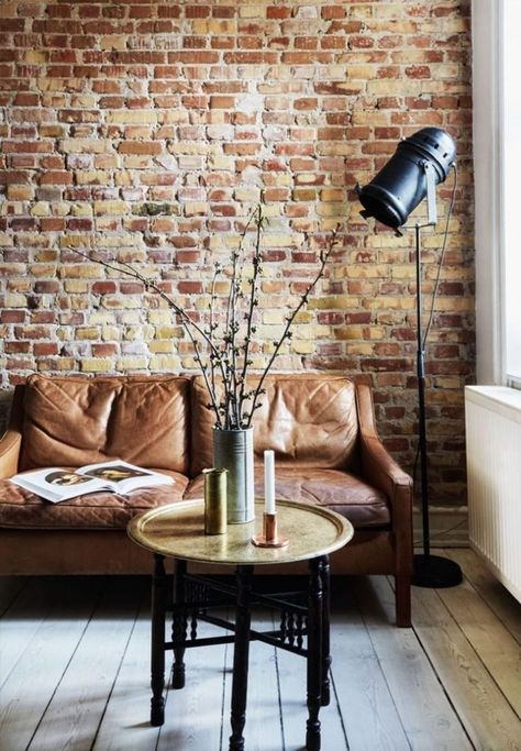 Dazzling New York-Inspired Industrial Loft with Exposed Brick Walls2 min read New Yorker Loft, Amazing Apartments, Brick Interior, New York Loft, Brick Loft, A Brick Wall, Exposed Brick Walls, Trendy Living Rooms, Brick Walls