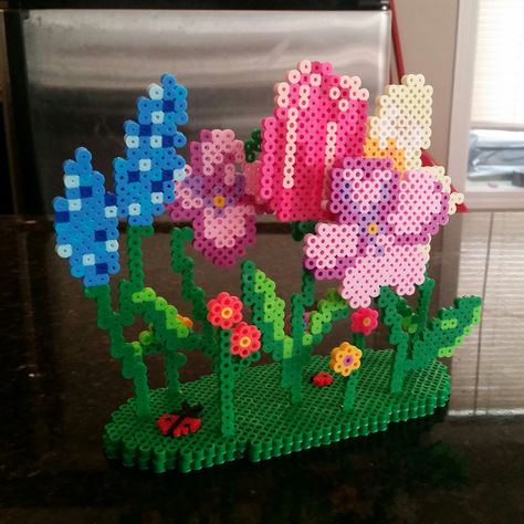 3D Flower garden perler beads by BreeBeer Modele Pixel Art, Hamma Beads Ideas, Melty Bead Patterns, Pearl Beads Pattern, Easy Perler Beads Ideas, 3d Perler Bead, Hama Beads Design, Diy Perler Bead Crafts, Perler Bead Templates