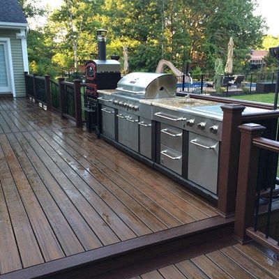 This backyard project includes a multilevel Trex Deck with cooking area leading down to a Cambridge stone patio Backyard Grilling Area, Backyard Patio Deck, Diy Backyard Patio, Patio Deck Designs, Backyard Grilling, Deck Designs Backyard, Pergola Design, Trex Deck, Backyard Kitchen