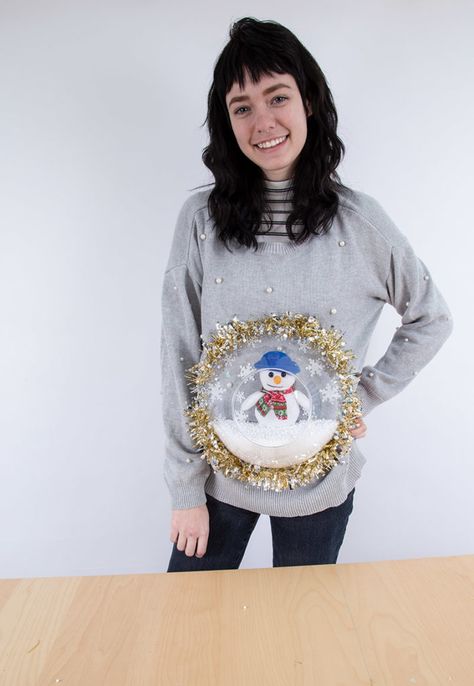 Person wearing a DIY holiday sweater with a plastic bowl and snowman stuffed animal glued to the front making it look like a snowglobe Craft Night Party, Diy Christmas Sweater, Buffalo Exchange, Ugly Sweater Diy, Diy Ugly Christmas Sweater, Marker Crafts, Snowflake Sticker, Diy Snow Globe, Holiday Sweaters