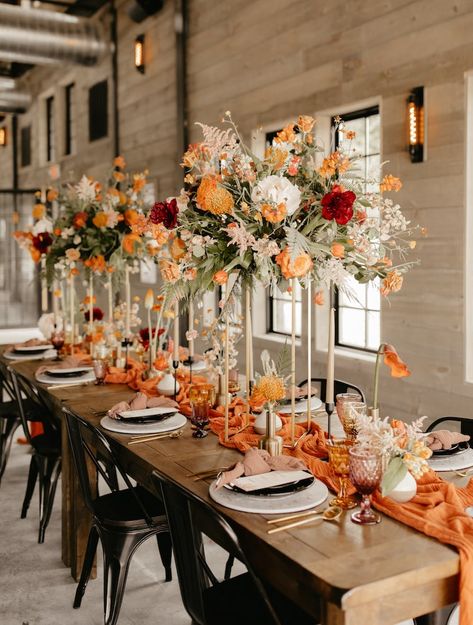 Fall Boho Vibes at Rivers Lodge - Wed KC Kansas City Wedding Experts August Wedding Decor, Elegant Fall Wedding Centerpieces, Burnt Orange Wedding Colors, Burnt Orange Boutonniere, Bridesmaid Dresses Burnt Orange, Tan Groom Suit, Wedding Colors 2025, Orange Wedding Centerpieces, Diy Centrepieces