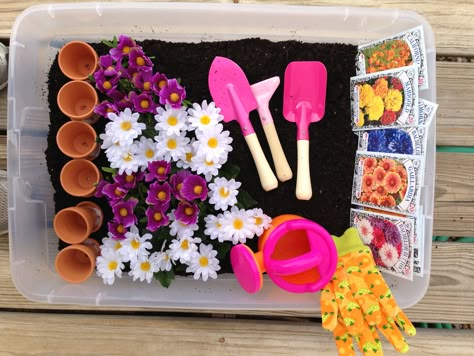 Made a gardening sensory bin for Chloe! Potting soil, seed packages, Mini pots, tools, gloves, watering can and fake flowers! Spring Garden Sensory Bin, Soil Sensory Bin, Seed Sensory Bin, Gardening Sensory Bin, Flower Sensory Bin, Flower Sensory, Garden Sensory Bin, Spring Sensory Bin, Garden Sensory