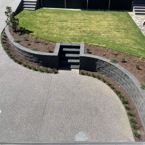 Retaining Wall Pathway, Sloped Driveway Retaining Wall, Landscape Around Retaining Wall, Mini Retaining Wall, Retaining Wall Driveway Front Yard, Retaining Garden Wall Ideas, Sloped Yard Retaining Wall, Retaining Wall Landscape Front Of House, Driveway Retaining Wall Ideas