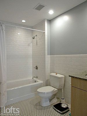 White subway tile wraps the wall behind toilet and vanity for easy cleaning Tile Behind Toilet, Behind Toilet, Bathtub Shower Remodel, White Subway Tile Shower, Tub To Shower Remodel, Small Full Bathroom, Shower Remodel Diy, Tile Backsplash Bathroom, Small Shower Remodel