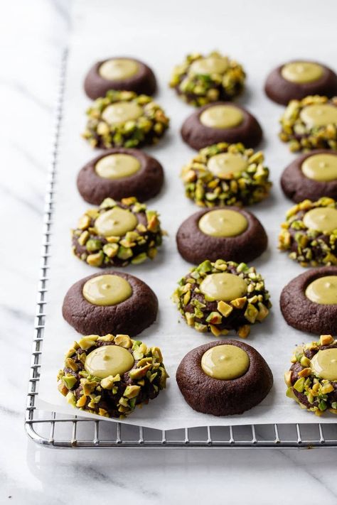 Best Things To Cook December 2022 Bakery Style Baked Goods, Chocolate Pistachio Thumbprint Cookies, Cute Chocolate Desserts, Treat Tray Ideas, Recipes Using Pistachio Cream, Recipes With Pistachio Cream, Pistachio Butter Dessert, Pistachio Christmas Cookies, Christmas Sweet Ideas