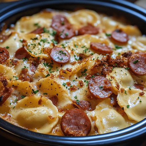 Enjoy a hearty Crockpot Pierogi Casserole with Kielbasa—easy to make, comforting, and perfect for any family meal! Cajun Pierogi Bake, Crockpot Perogie And Sausage, Perogies And Sausage Crockpot, Kielbasa And Perogies Recipes Crockpot, Kielbasa Sauerkraut And Pierogies Crockpot, Perogies Casserole, Crockpot Pierogies, Perogi Casserole, Crockpot Pierogi Casserole