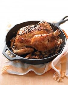 Get a taste of the French countryside: chicken with mild, buttery roasted garlic -- yes, 40 cloves of it -- and a few sprigs of thyme. C'est tout! Roasted Vegetables With Chicken, Martha Stewart Recipes, Roast Chicken Recipes, Garlic Recipes, Fall Spices, Cast Iron Cooking, Chicken Legs, Garlic Chicken, French Countryside