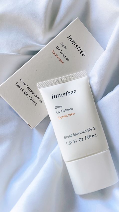 Innisfree sunscreen, bottle and box on a bed sheet next to each other. Innis Free Sunscreen, Innisfree Skincare Aesthetic, Innisfree Aesthetic, Skincare Set Package, Aesthetic Sunscreen, Innisfree Sunscreen, Sunscreen Aesthetic, Innisfree Skincare, Dream Skincare