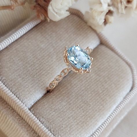 This ring, which you can choose as an engagement ring or a marriage proposal ring, is made in vintage style with ice blue aquamarine stones and diamonds. It will take you on a journey to Victorian times and feel the spirit of the times. Aquamarine & Diamond Vintage Design Ring ✰ Diamonds: 0.10 Carat ✰ Diamonds Clarity: SI F ✰ Aquamarine: 1.10 Carat ✰ 14K Solid Gold  ✰ Rose Gold | White Gold | Yellow Gold ✰ You can choose gold color of rings. ✰ Aquamarine and diamond stones are 100% natural. ✰ Or Sapphire Aquamarine Ring, Blue Engagement Ring Vintage, Light Blue Topaz Engagement Ring, Light Blue Diamond Engagement Ring, Wedding Ring Aquamarine, Blue Ring Engagement, Blue Zircon Engagement Ring, Pearl And Sapphire Ring, Engagement Rings Topaz