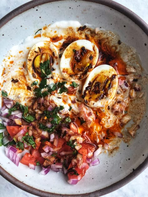 Perfectly poached eggs with a silky yolk over tangy yogurt with onions, tomatoes, and drizzled with a cumin chili oil and cilantro. Chili Oil Recipe, Chili Oil, Savory Breakfast, Poached Eggs, Egg Recipes, Food Recipe, Traditional Food, Veggie Recipes, Brunch Recipes