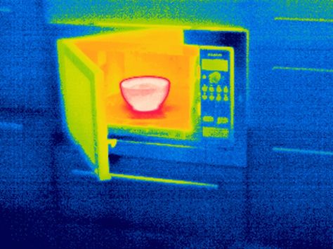 A thermal image of a bowl of food in a microwave. How does it warm up without a flame or heating element? SCIENCE PHOTO LIBRARY / GETTY IMAGES Thermal Image, Photography Inspiration Nature, Paw Cleaner, Science Photos, Microwave Ovens, Thermal Imaging, Creative Poster Design, Sky Art, The Vault