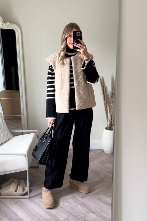 Sunday roast comfy casual outfit river island shearling gilet is sold out, I’ve linked some similar ones below. Toteme stripe jumper size s (save £40 at Farfetch using code CBSAVE) Reona trousers size xs Ugg ultra mini in sand Ysl sac de jour (Uk size 8 bottoms 10 top) #uggboots #shearling #stripes #casual #casualoutfit #comfy Follow my shop @charlottebuttrick on the @shop.LTK app to shop this post and get my exclusive app-only content! #liketkit #LTKstyletip #LTKeurope #LTKSeasonal @s Uggs Sand Outfit, Sheepskin Gilet Outfit, Sherpa Gilet Outfit, Cream Gilet Outfit Women, Ugg Ultra Mini Sand Outfit, Cream Gillet Outfit, Ultra Mini Uggs Sand, Fluffy Gilet Outfit, Sunday Roast Outfit