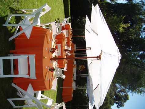 Orange table linens with umbrellas. Backyard Umbrella, Umbrella Party, Backyard Baby Showers, Graduation Dinner, Orange Table, Garden Party Decorations, Umbrella Wedding, Outdoor Backyard, Peach Wedding