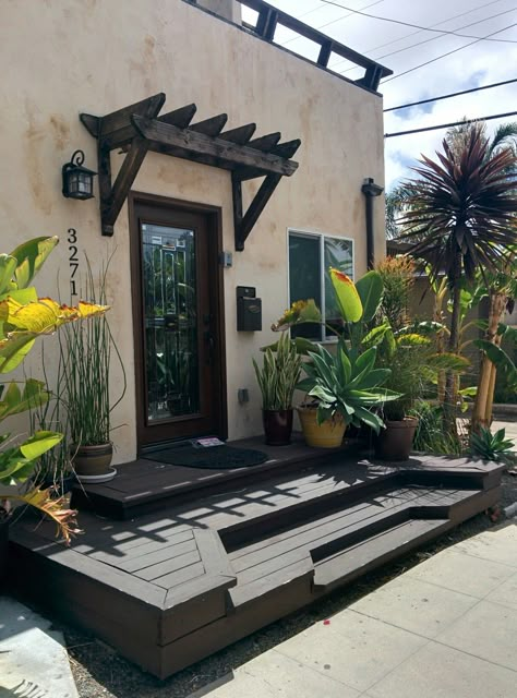 Open porch deck and tiny Spanish colonial pergola over front door Pergola Over Front Door, Front Door Pergola, Window Pergolas, Door Pergola, Pergola Swing, Pergola Attached To House, Covered Pergola, Pergola With Roof, House With Porch