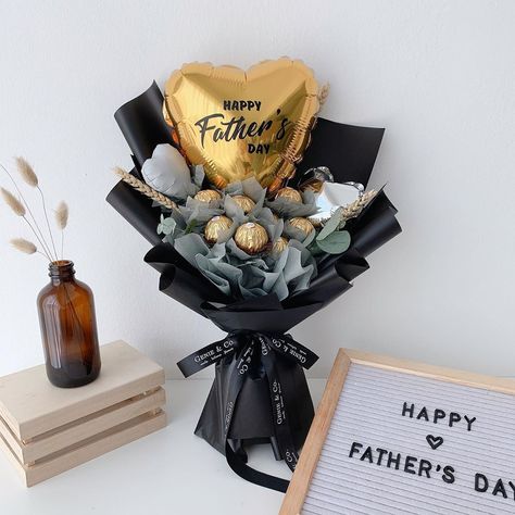 Genie Floral on Instagram: “💫FATHER’S DAY 2020🌻  Who says dads can’t receive bouquets on Father’s Day? Surprise him with a delectable Ferrero Rocher bouquet this year.…” Men’s Flower Arrangement, Father Day Bouquet Ideas, Bouquet For Father's Day, Guy Bouquet Gift, Father's Day Floral Arrangements, Father Day Bouquet, Father's Day Gift Bouquet, Fathers Day Flower Arrangements Ideas, Ferrorocher Bouquet