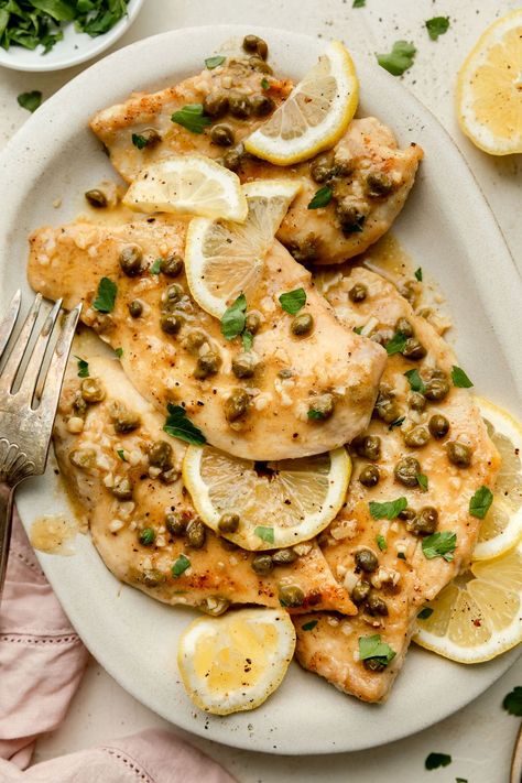 This light and lemony Chicken Piccata recipe features quick-cooking moist chicken with a lemony caper sauce. Gluten free option included. Lemon Chicken Piccata Recipe, Lemony Chicken, Lemon Chicken Piccata, Piccata Recipe, Over Mashed Potatoes, Chicken Piccata Recipe, Caper Sauce, Moist Chicken, American Dishes