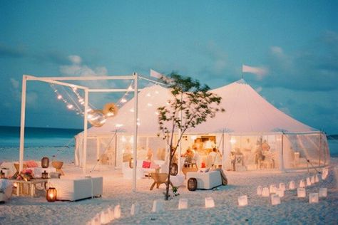 This white tent, surrounded by candles in white paper bags, blends perfectly into its beach setting. We love the flags up top�—and the clear sides, which prevent guests from being splashed by crashing waves nearby. Bahamas Wedding, Beach Wedding Reception, Wedding Beach Ceremony, Outdoor Wedding Reception, Beach Wedding Decorations, Beach Theme Wedding, Beach Chic, Wedding Checklist, Glam Wedding