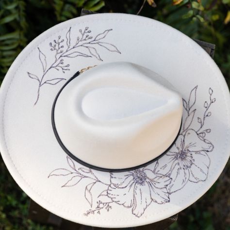 Hand Burned Cream Festival Hat - Felt Wide Brim Rancher Hat Pyrography Wedding Maternity Beach Bachelorette Cowboy Floral Flowers

This gorgeous hand burned rancher hat is PERFECT for a day with your favorite hoofed friend or that festival you've been planning for all year!
Each design is drawn and then burned by hand with a wood burner.

It's all man made materials (polyester) with a black band and gold chain. Size is adjustable and measures approximately 23 inches at its largest. Burning Hats Diy, Black Burned Felt Hat, Burned Felt Hat, Woodburn Felt Hat, Burnt Hat Design, Burned Rancher Hats, Felt Hat Burning Designs, Burned Hats Sunflower, Burned Hats