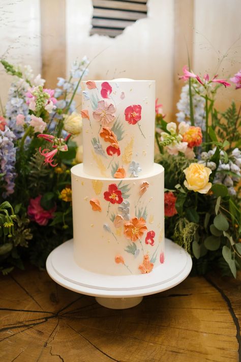 Wedding Cake With Painted Flowers, Spring Wedding Cake 2 Tier, Vibrant Color Wedding Cake, Simple Wedding Cake 2 Tier Flowers, Wedding Cakes With Icing Flowers, Wild Flower Cake Wedding, Bright Flower Wedding Cake, Wedding Cake With Tulips, Simple Colorful Wedding Cake