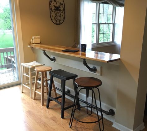 My bar on the half wall. Hickory Bar Top with galvanized pipe supports and foot rail. Mismatched stools. Kitchen Bar Window, Half Wall Kitchen, Bar Table Diy, Bar Window, Breakfast Bar Table, Pony Wall, Half Walls, Breakfast Bar Kitchen, Bar Top