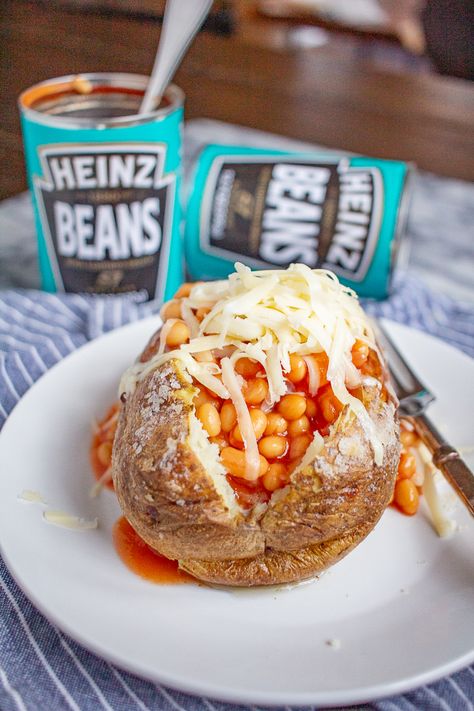 Jacket Potatoes with Beans | This classic British meal is an easy to prepare dinner. Jacket Potato And Beans, Baked Beans In Tomato Sauce, English Potatoes, Jacket Potato Recipe, Beans In Tomato Sauce, British Snacks, Heinz Baked Beans, Jacket Potatoes, British Cooking