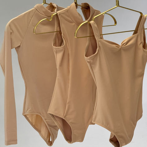 Shop Mariia True Bare for neutral essentials like these. Link in bio!!   #neutrals #discountdance #fashion #leotardshopping #lovedds #leotards #ballet Ballet Leotards Yumiko, Balletcore Fashion, Childrens Leotards, Dance Stretches, Ballet Leotards, Dance Teacher Gifts, Camisole Leotard, High Neck Crop Top, Discount Dance