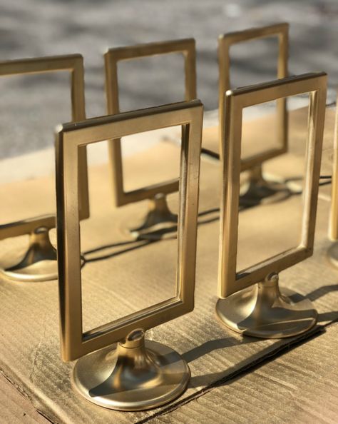 DIY Gold Table Number Holders Using $0.99 Ikea Tolsby Frames – angelahums Diy Gold Table, Diy Table Number Stands, Standing Picture Frames, Gold Table Number Holders, Diy Kallax, Ikea Tolsby Frame, Gold Table Number, Framed Table Numbers, Table Numbers Wedding Diy