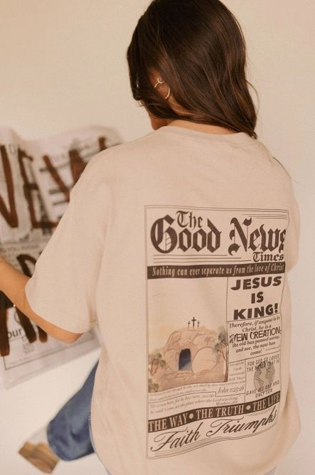 Women's Christian Graphic Tee 📰✨ The Good News Vintage Graphic Tee ✨✝️ Extra, extra—read all about it! 📰🙌 The Good News Vintage Graphic Tee is here to spread faith and truth in the cutest way! 💕 This soft, neutral-toned tee features a minimal front design with "Good News" printed on the chest, while the back steals the show with a stunning, vintage-inspired newspaper layout declaring the greatest news of all—JESUS IS KING! ✝️✨ Featuring a beautiful depiction of the empty tomb, powerful Bible The Empty Tomb, Newspaper Layout, Christian Graphic Tees, Empty Tomb, Sunday Service, Powerful Bible Verses, Jesus Is King, Vintage Graphic, The Good News