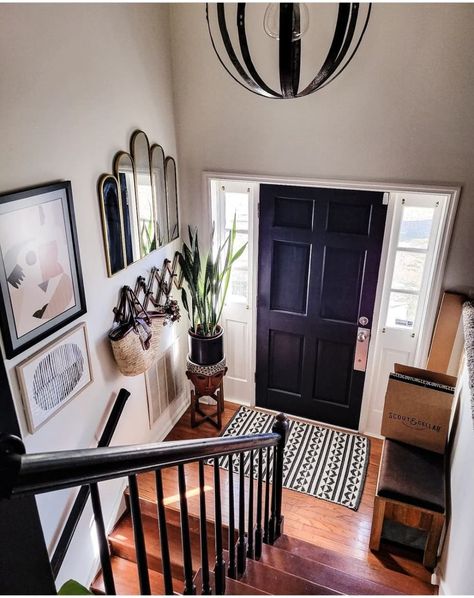 View from the top of the stairs to the front door Scandi Hallway, Split Foyer Remodel, Moody House, Moody Home, Interior Front Door, Home Entryway, Top Of The Stairs, Navy Walls, Mcm House