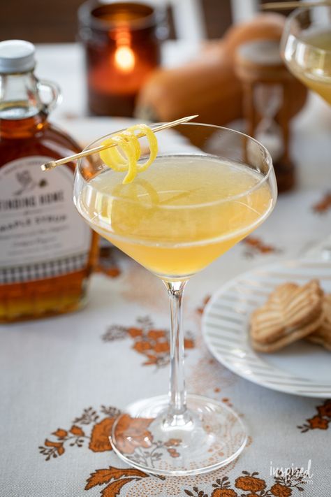 maple martini in a glass with lemon twist garnish. Maple Martini, Ice Cream Float Recipes, Autumn Drink, Holiday Punch Recipe, Unique Cocktail Recipes, Float Recipes, Ice Cream Shake, Lemon Vodka, Fall Cocktails Recipes