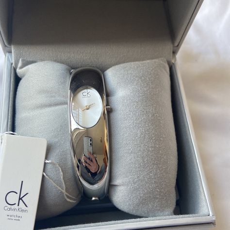 Calvin Klein Women's Exquisite Swiss Made Quartz Silver-Tone Dial Stainless Bangle Bracelet Watch -Comes With A Booklet - Water Resistant - See Last Pics For More Description Never Been Used, Still Has Tags Calvin Klein Watches Women, Small Silver Watch, Calvin Klein Bracelet, Calvin Klein Glasses, Silver Bracelet Watch, Calvin Klein Watch, Calvin Klein Jewelry, Ck Calvin Klein, Bangle Watches