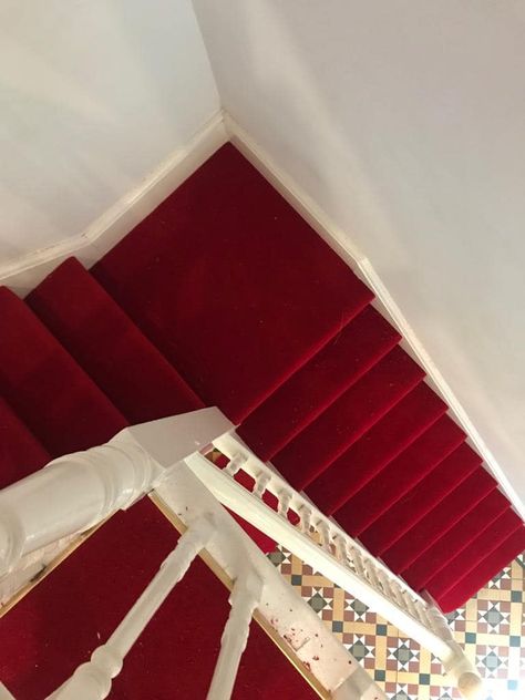 A stunning installation of a wool twist carpet from Hugh Mackay.  (Pictured: Durham twist 50oz Carpet colour Pillar box red) Red Carpet Staircase, Red Stair Carpet, House Of Hackney Stair Runner, Carpet Runner On Stairs Victorian, Wool Twist, Stark Carpet Stair Runner, Carpet Stair Treads Uk, Carpet Staircase, Luxurious Rooms