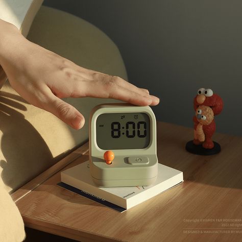 The Gameboy alarm clock from MUID has a playful design with a retro style. Tap the top to snooze the alarm, use the joystick to adjust the time, and tap the front button to pause the timer. Alarm Clock Photography, Study Timer Clock, 6 Am Aesthetic, Alarm Aesthetic, Alarm Clock Aesthetic, Job List, Study Timer, Alarm Clock Design, College Dorm Apartment