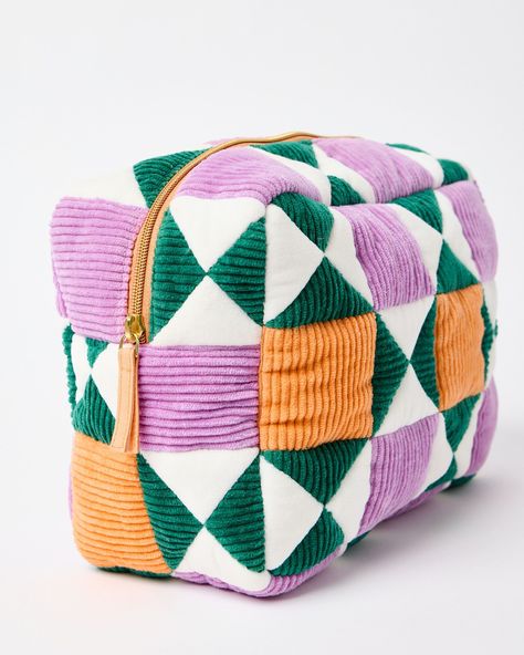 Fabric wash bag made from patchwork orange, green and purple corduroy sewn in a geometric pattern. Cute Geometric Pattern, Cotton Patchwork Bag For Travel, Trendy Patchwork Tote Bag, Square Cotton Patchwork Bag, Patchwork Toiletry Bag, Patchwork Cosmetic Bag, Quilters Bag, Patchwork Pouch, Sewing Pouch