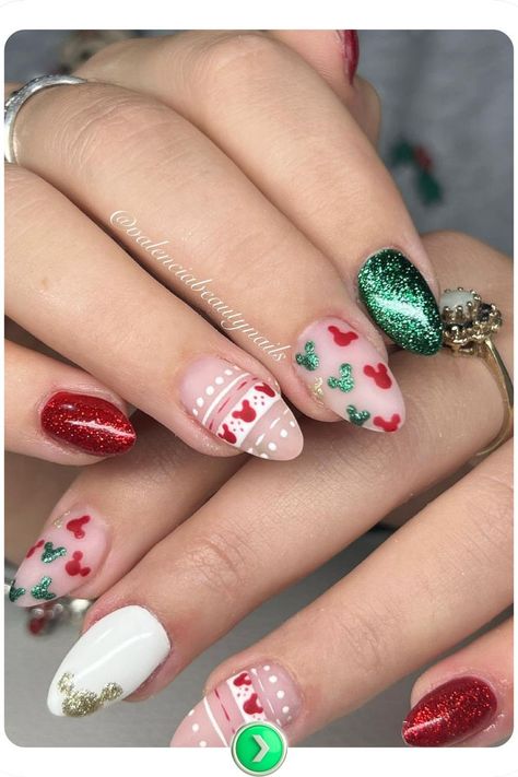 Disney-inspired holiday nail design featuring striped patterns, Mickey silhouettes, and sparkles. A vibrant and cheerful choice for holiday festivities. Disney Christmas Gel Nails, Disney Gingerbread Nails, Disney World Christmas Nails, Short Disney Christmas Nails, Mickey Christmas Nails Design, Christmas Movie Nail Art, Holiday Disney Nails, Fun Holiday Nails, Grinchmas Nails