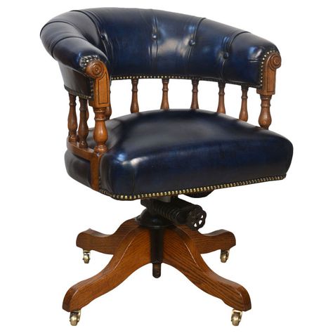 Oak Captains Desk Chair  England  Circa 1900  oak swivel office chair, with shaped button back, above blue leather upholstered seat, raised on four supports terminating with castors Vintage Office Chairs, Painting Kitchen Chairs, Nautical Office, Piano Chair, Game Room Chairs, Traditional Dining Set, Captain Chairs, Vintage Desk Chair, Wood Office Chair