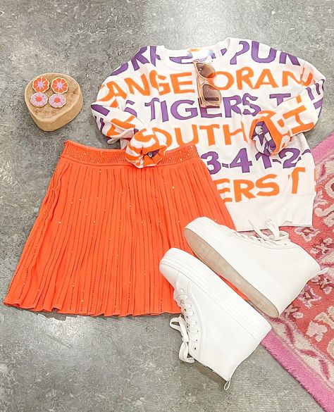 These Clemson Tiger Sweaters are your new best friend when you need a comfy, but cute, outfit for tailgating, watching football & celebrating victories. 🏈🐅 . . . . . #clemson #clemsonfootball #clemsonuniversity #clemsontigers #tigers #orangeandpurple #tigernation #tailgate #gameday #gamedress #gamedaydress #gamedress #dress #instafashion #game #team #gameon Clemson Tailgate Outfit, Tie Strap Top, Rust Top, Orange Outfits, Clemson Fans, Jungle Queen, Gameday Outfits, Watching Football, Clemson Football