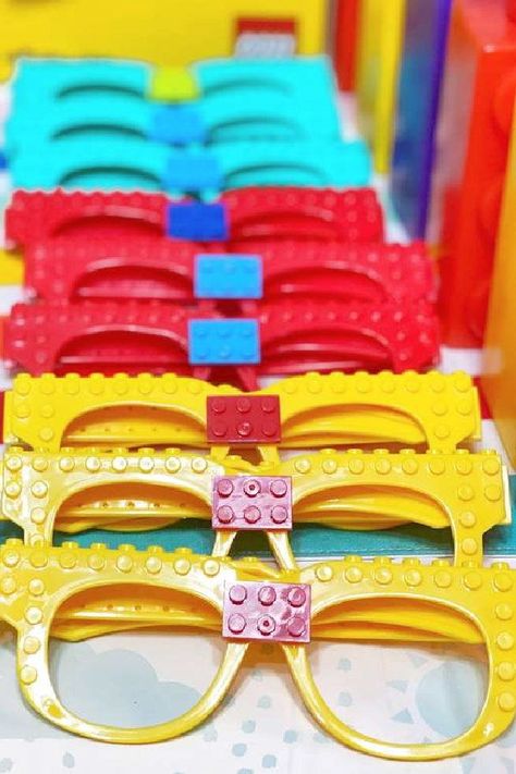 Don't miss this bright and colorful Lego birthday party! The Lego glasses party favours are amazing! See more party ideas and share yours at CatchMyParty.com Lego Giveaway Ideas, Lego Birthday Party Backdrop, Lego 4th Birthday Party, Lego Graduation Ideas, Lego Dinosaur Party, Girl Lego Birthday Party, Lego Party Ideas Decoration, Lego Pool Party, Lego Birthday Party Games