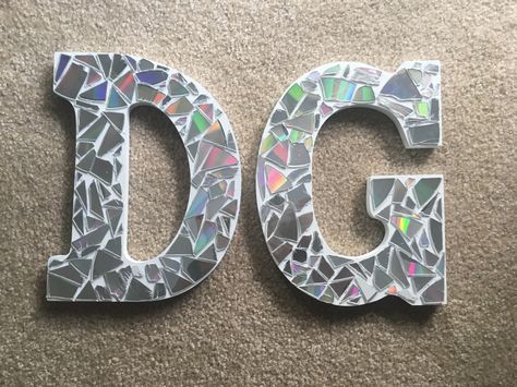 Mosaic sorority letters made from old CD's Delta Gamma Letters Painted, Disco Sorority Letters, Sorority Letter Ideas, Sorority Wooden Letters, Diy Letter Decor Initials, Sorority Painted Letters, Sorority Letters Painted Wooden, Painted Sorority Letters, Diy Letter Decor