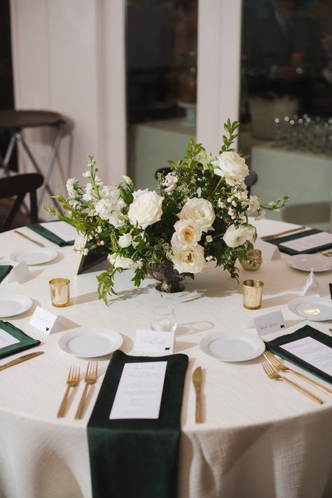 Low floral centerpieces for elegant winter wedding overflowing with white garden roses, dried hydrangeas, scabiosa, berries, lisianthus, ranunculus, and natural dark greenery. Designed by Rosemary and Finch in Nashville, TN. White Greenery Centerpieces, Winter Tablescapes Wedding, Lisianthus Centerpiece, White Green Wedding Centerpieces, Green White Centerpiece Wedding, Wedding Floral Centerpieces Round Table, White Flower Table Centerpiece, Greenery With White Flowers, All White Wedding Tablescape