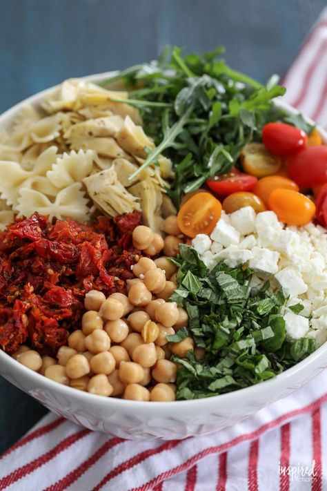 If you're looking for a pasta salad that brings a fresh twist to your table, this Sun-Dried Tomato Pasta Salad is just what you need. With its vibrant mix of sun-dried tomatoes, marinated artichoke hearts, and fresh basil, every bite is bursting with flavor. It's simple to prepare and makes a perfect side dish for any meal, whether it's a casual weeknight dinner or a festive summer celebration. Sundried Tomatoes Pasta, Sundried Tomato Pasta Salad, Tomato Recipes Healthy, Sundried Tomato Recipes, Marinated Artichoke Hearts, Sun Dried Tomato Pasta, Tomato Pasta Salad, Sundried Tomato Pasta, Classic Pasta Salad