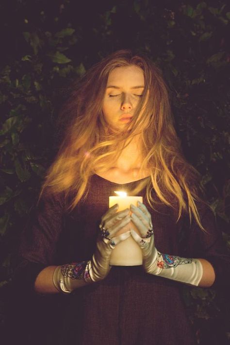 blonde girl holding a candle with embroidered white silk gloves on Holding Candle, Candle Magick, Halloween Photoshoot, Season Of The Witch, Witch Aesthetic, Witchy Woman, Candle Magic, Book Of Shadows, Ritual