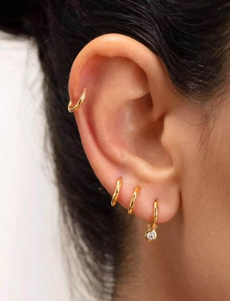 Our non tarnish gold vermeil CZ charm sleeper hoop earrings are the perfect everyday addition to your ears. Also choose from Sterling Silver too! ♥️ Real Gold-Plated Sterling Silver (Vermeil) Hoops ♥️ Choose your charm (heart or star) ♥️ Hypoallergenic ♥️ The perfect, everyday hoops ♥️ Choose your size ♥️ 1.2mm thickness ♥️ Small and Easy to put in ♥️ Free gift bag included, ready for gifting straightaway  This listing is for 1 hoop earring, if you need a pair please buy 2  For any more question Three Earlobe Piercings, 3rd Ear Piercing Ideas, 3 Hole Earring Ideas, 3 Lobe Piercings Ideas, Three Lobe Piercings, Piercings Oor, Triple Lobe Piercing, 3 Lobe Piercings, 4 Piercings