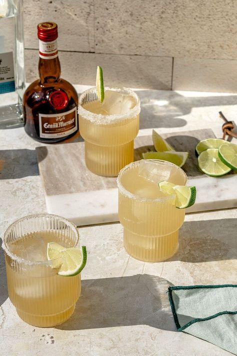 This Classic Margarita recipe uses freshly squeezed lemon and lime juice, organic simple syrup, Blanco tequila, and your orange liquor of choice. Each ingredient is selected with care and quality in mind to result in a simple and refreshing summer beverage, hitting that perfect balance between tart and sweet. Aesthetic Margaritas Drink, Margarita Presentation, Margarita Aesthetic, Margarita Wedding, Margarita Photography, Lemon Margarita, Fresh Margarita, Drink Night, Simple Cocktails