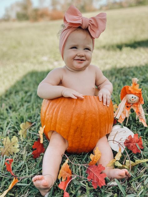 Milestone photo of A 10 month baby with a big pink bow in a pumpkin making a silly face with some orange and yellow fall leaves around the pumpkin and a mini scarecrow Pumpkin Pics, Old Photoshoot, Baby Pumpkin, Baby Milestone Photos, Milestone Photos, Pumpkin Pictures, Pin Pics, Photoshoot Idea, Pumpkin Baby