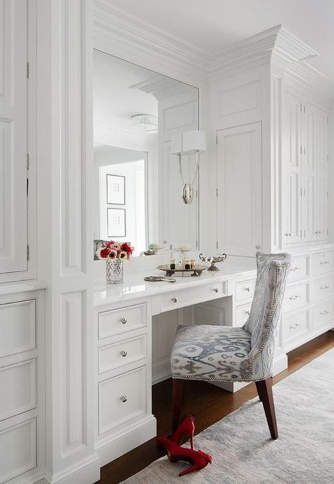 Gorgeous dressing room features a white built in makeup vanity topped with white marble under a framed mirror illuminated by Ruhlmann Single Sconces alongside a blue and gray ikat chair. Makeup Storage Bedroom, Closet With Vanity, Mirrors Bedroom, Built In Vanity, Large Mirrors, Closet Vanity, White Closet, Bedroom Desk, Wardrobe With Dressing Table